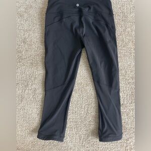Lululemon size 8 leggings with mesh panel on back of the legs.